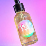 Bottle labeled 'Double Take' with a colorful label on a gradient background