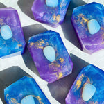 Spirit of Eternity soap by Crystal Bar Studio featuring an opalite crystal, handcrafted vegan bar soap scented in coconut and mango for tropical serenity and clarity.